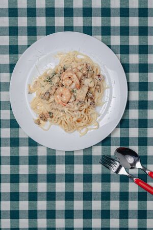 appetizing Italian pasta with seafood and king prawns, spaghetti with sauceの写真素材