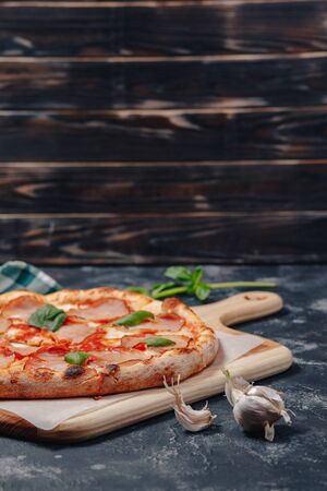 delicious Neapolitan meat pizza on board, pizzeria and delicious foodの写真素材