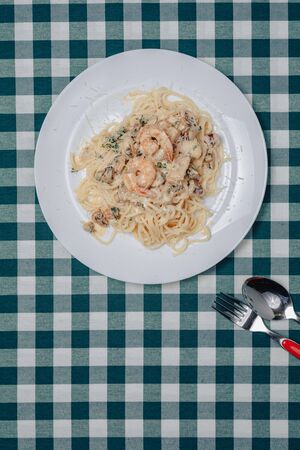 appetizing Italian pasta with seafood and king prawns, spaghetti with sauceの写真素材