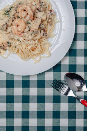 appetizing Italian pasta with seafood and king prawns, spaghetti with sauceの写真素材