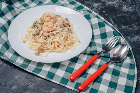 appetizing Italian pasta with seafood and king prawns, spaghetti with sauceの写真素材