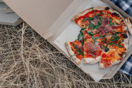 pizza on the lawn in boxes at summer partyの写真素材