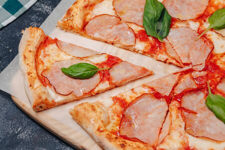 delicious Neapolitan meat pizza on board, pizzeria and delicious foodの写真素材