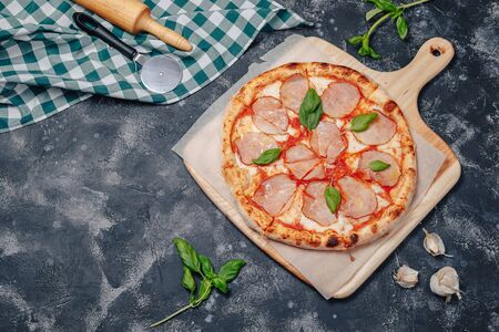 delicious Neapolitan meat pizza on board, pizzeria and delicious foodの写真素材