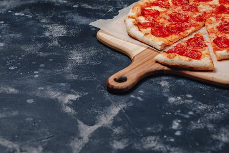 delicious Neapolitan meat pizza on board, pizzeria and delicious foodの写真素材
