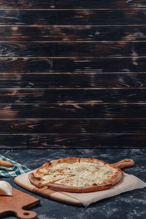 appetizing delicious Neapolitan pizza with cheese. four kinds of cheese. concept of delicious italian pizza.の写真素材