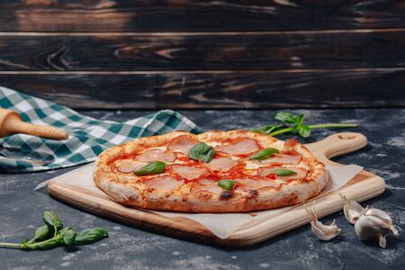 delicious Neapolitan meat pizza on board, pizzeria and delicious foodの写真素材
