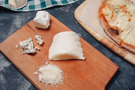 appetizing delicious Neapolitan pizza with cheese. four kinds of cheese. concept of delicious italian pizza.の写真素材
