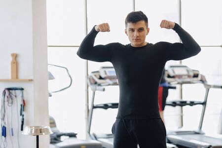 stylish guy in the gym posing for a photo. Healthy Lifestyle. sport life.の写真素材