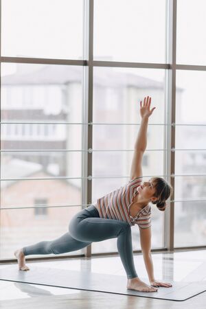 young attractive girl doing yoga, sports and healthy lifestyles, the concept of mental balance