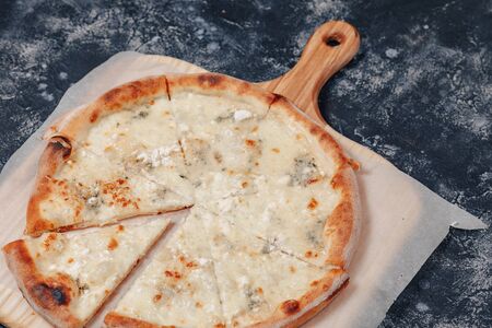 appetizing delicious Neapolitan pizza with cheese. four kinds of cheese. concept of delicious italian pizza.の写真素材
