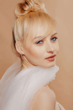 pretty attractive girl with blond hair, fashion shooting, rose, simple background, studioの写真素材