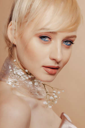 pretty attractive girl with blond hair, fashion shooting, rose, simple background, studioの写真素材