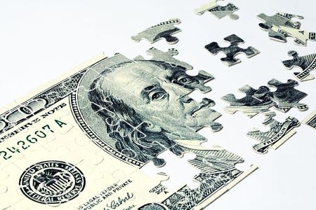 Image of dollar made of puzzles over white backgroundの写真素材