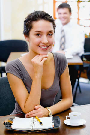Portrait of a confident business woman with charming smile in the cafeの写真素材