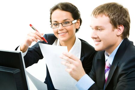 Business woman and man looking at the document and discussingの写真素材