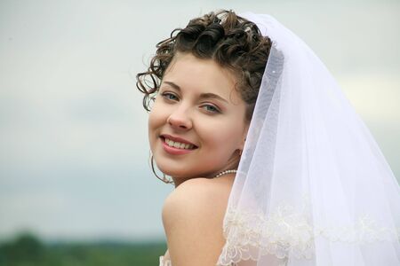 Portrait of happy bride looking at camera with smile の写真素材