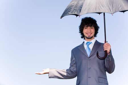 Photo of successful manager showing the termination of a rainの写真素材