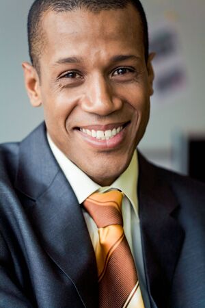 Portrait of attractive man looking at camera and smilingの写真素材