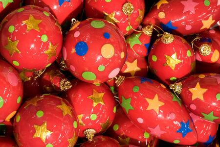 Close-up of Christmas balls of red color decorated with stars