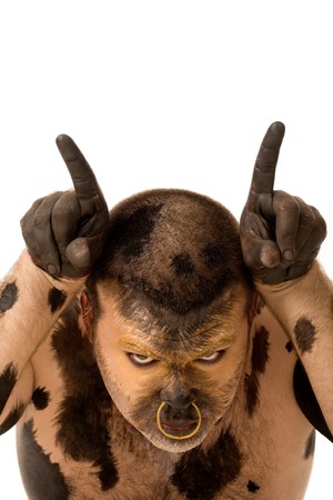 Head of painted male imagining himself being a bull and looking at cameraの写真素材