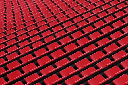 Background of red chairs in rows of stadiumの写真素材