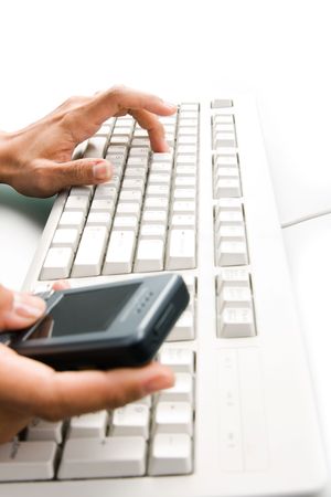 Close-up of female hands by keyboard pressing buttons of palmtop device