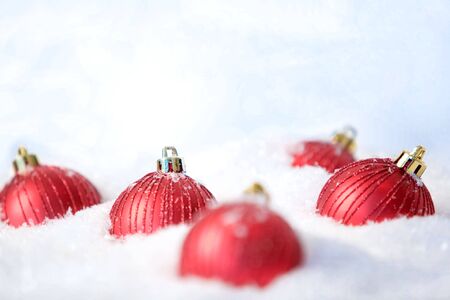 Image of red decorative toy balls in the snowの写真素材