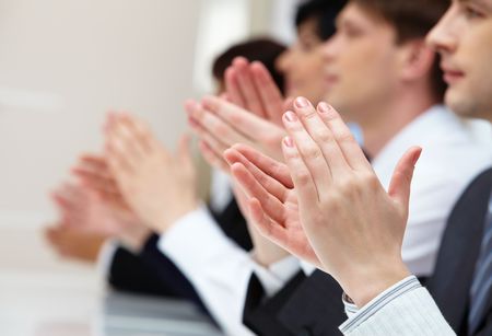 Photo of business partners hands applauding at meetingの写真素材