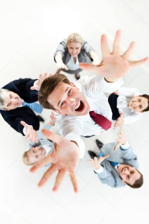 Above view of several successful partners throwing new ceo upwards 