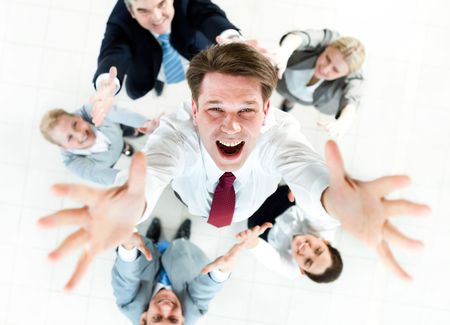 Above view of happy chief being thrown by several partners upwards の写真素材
