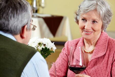 Image of beautiful senior woman looking at her husband with love の写真素材