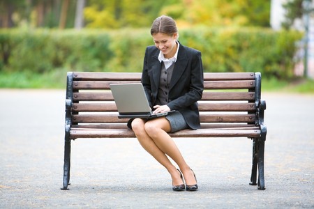 Image of elegant employer sitting on the benchの写真素材