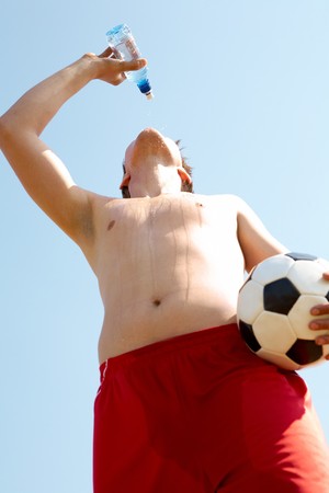 Portrait of a soccer player refreshing during break の写真素材