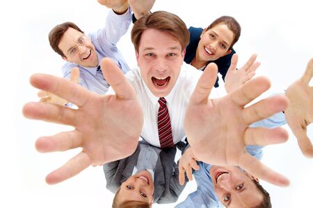 Above view of happy chief surrounded by several partners looking upwards の写真素材