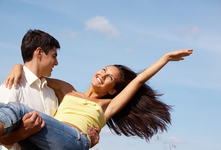 Image of handsome man and beautiful girl enjoying summer togetherの写真素材