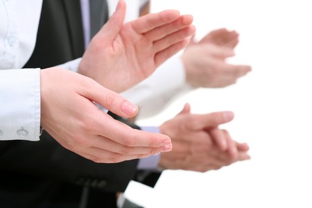 Photo of businesswomans hands applauding at background of partnersの写真素材