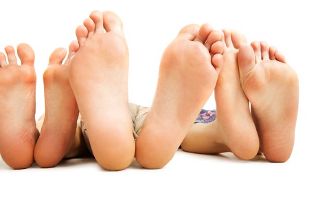Close-up of human soles during relaxation on white backgroundの写真素材
