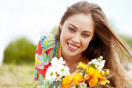 Image of happy female with wildflowers on summer dayの写真素材