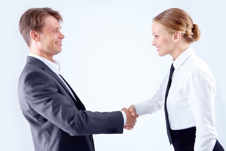 Photo of successful business partners handshaking after striking great dealの写真素材