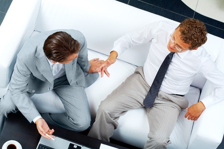 Image of two business partners discussing work at meetingの写真素材