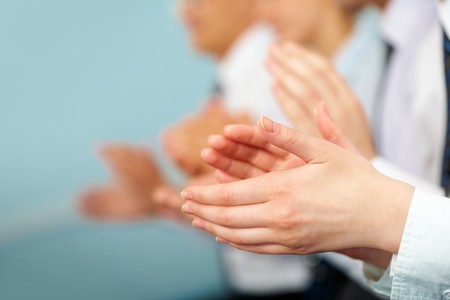 Photo of business partners hands applauding at meetingの写真素材