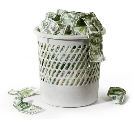 Close-up of million dollars in trash on a white backgroundの写真素材