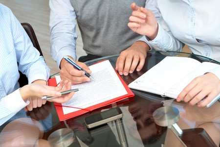 Image of business people hands working with papers at meeting
