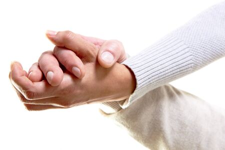 Photo of male and female hands holding each other