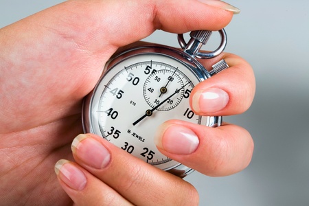 Portrait of female hand holding  the stop-watch