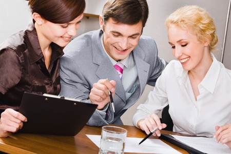 Portrait of young specialists working together in the officeの写真素材