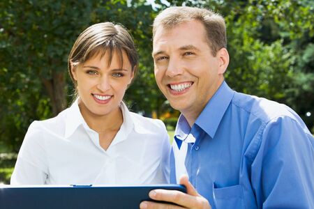 Portrait of business team working together outsideの写真素材