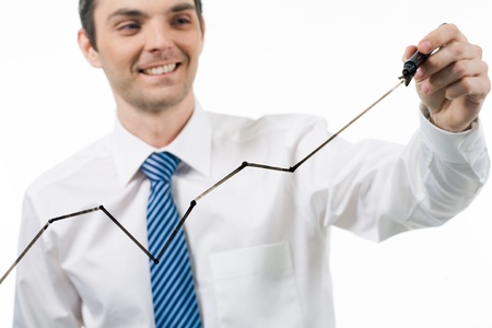 Close-up of male with black highlighter in hand drawing graphの写真素材