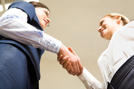 Photo of businesswomen handshaking in the officeの写真素材